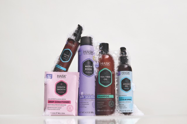 spraying hask charcoal dry shampoo